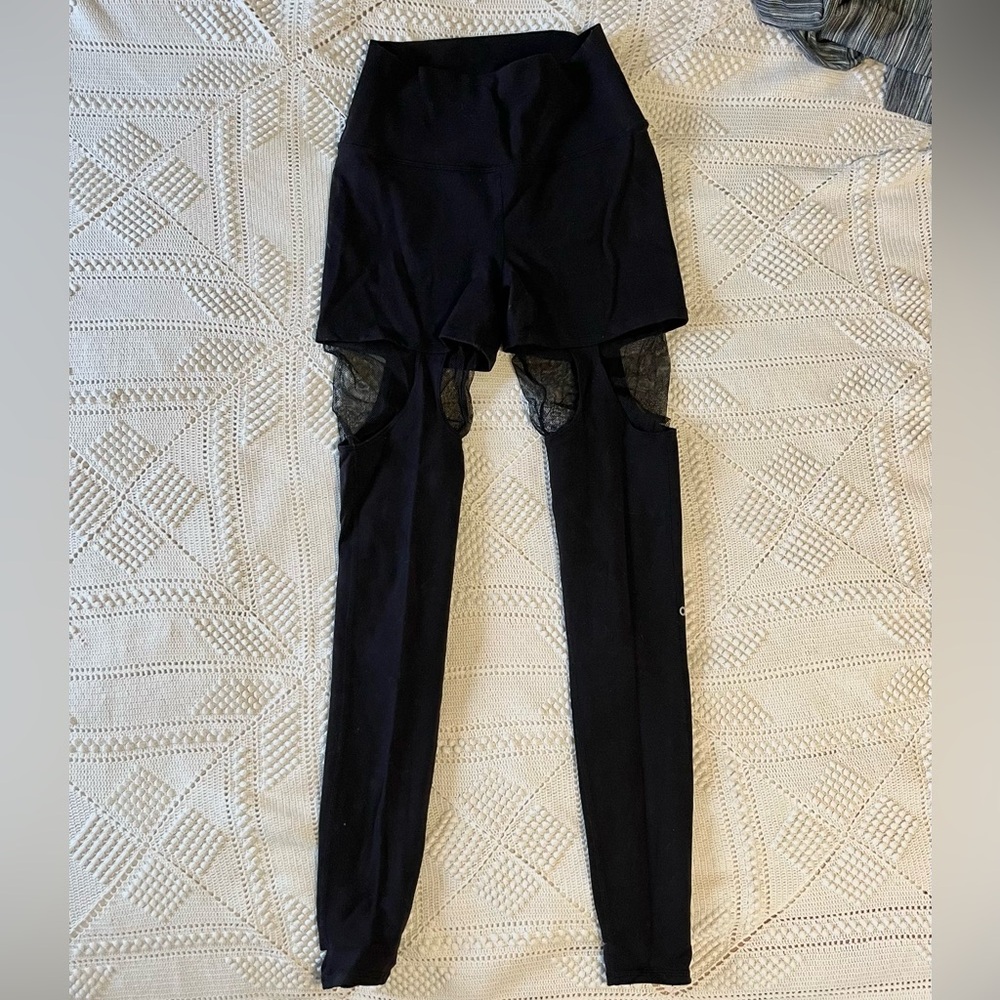 ALO yoga black leggings size XS with mesh cutouts.